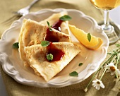 Crepes with strawberry sauce