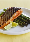 Grilled salmon fillet on green asparagus