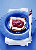 Wholemeal bread with soft cheese and berry puree