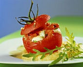 Tomatoes stuffed with mozzarella on polenta cream