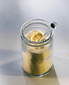 Carob powder in jar