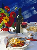 Goulash with peppers & home-made noodles, knife & fork