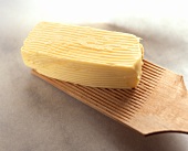 A Stick of Butter with Marks from Paddle