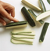 Slicing courgette thinly lengthwise