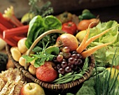 Fruit and vegetables in a basket and beside it
