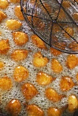 Chestnut flour fritters in deep-frying fat