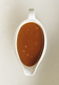 Caramel sauce in a sauce boat