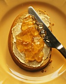 A slice of bread with quince jelly