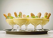 Advocaat mousse with sponge fingers in champagne glasses