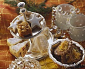 Various Christmas biscuits in dish and on tiered stand