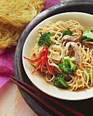Rice noodles with pork fillet, broccoli and chili pepper