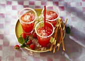 Three glasses of strawberry daiquiri (rum-based cocktail)