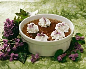 Chocolate mousse with cream and candied violets