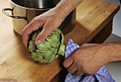 Removing the stalk from an artichoke