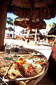 Fish platter with seafood on beach