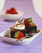 Chocolate slice with cream and strawberries