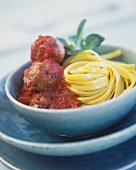 Meatballs with tomato sauce and ribbon noodles