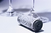 Wine corks in front of two glasses (black and white photo)