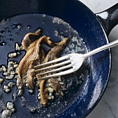 Sautéing anchovy fillets