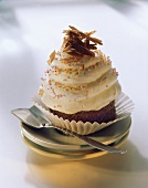 Ice cream cake with cream, chocolate curls & sugar pearls