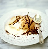 Poached pear with ice cream, decorated with chocolate