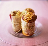 Cranberry muffins wrapped in paper