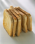 Slices of toast, placed upright 