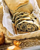 Poppy seed stollen in a bread basket