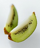 Two wedges of kiwi fruit