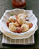 Strawberry fritters with icing sugar