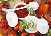 Tomato soup and creamed herb soup in soup bowls
