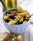 Penne with chili peppers, olives and tomatoes
