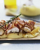 Cod in pancetta on mashed potato with oranges
