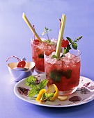 Drink with lemon grass, mint and cocktail cherry