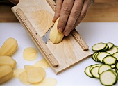Thinly slicing potatoes