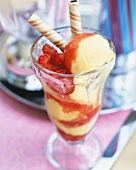Mango sorbet with strawberry sauce and wafers