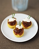 Polenta cakes with onion confit and sour cream