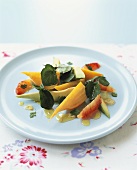 Avocado salad with carrots and pink grapefruit