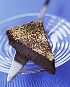 Piece of chocolate mousse cake with gold dust
