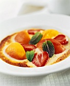 Poached peaches and strawberries in vanilla cream