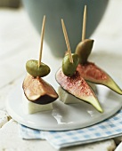 Figs, cheese and olives on cocktail sticks