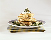 Pancakes with watercress and sour cream