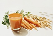 Carrot juice, fresh carrots and cereal ears