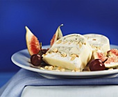 Cheese terrine with nuts, figs and red grapes