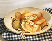 Sweet pasta parcels with apples and apple puree
