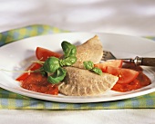 Spelt pasties with tomato sauce and basil
