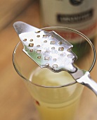 Absinthe spoon with remains of dissolved sugar