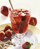 Strawberries in red wine marinade with pistachios