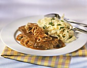 Steak and onions with ribbon pasta