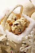 Macaroons in basket, surrounded by Christmas decorations